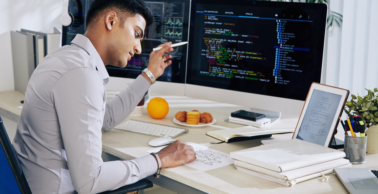 Pensive,Indian,Developer,Checking,Structure,Chart,When,Working,On,Programming